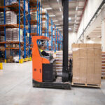 electric pallet stackers being used in warehouses